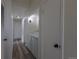 Hallway laundry area features modern washer and dryer at 7042 W 76Th Ave, Arvada, CO 80003