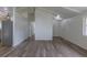 Bright living room boasts hard surface flooring and fresh paint at 7042 W 76Th Ave, Arvada, CO 80003