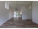 Inviting living room features vaulted ceilings, wood floors, and light paint that creates a bright space at 7042 W 76Th Ave, Arvada, CO 80003