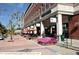 Commercial street featuring storefronts, outdoor seating and lovely landscaping at 10780 Wheatfield Ln, Parker, CO 80138