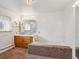 Bright bathroom featuring a built-in tub, vanity, window, and simple decor at 423 Empire St, Aurora, CO 80010