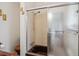 Bathroom featuring a shower and tub with tiled walls and a sliding glass door at 423 Empire St, Aurora, CO 80010