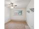 Cozy bedroom featuring neutral walls, carpeted floors, and a bright window at 423 Empire St, Aurora, CO 80010