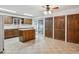 Spacious kitchen featuring ample cabinet space, an island, and an adjacent dining area at 423 Empire St, Aurora, CO 80010