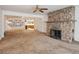 Spacious living room with stone fireplace and adjoining spaces at 423 Empire St, Aurora, CO 80010
