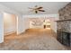 Open-concept living room with stone fireplace and view into adjacent rooms at 423 Empire St, Aurora, CO 80010