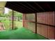 Back patio overlooking a large, grassy backyard and featuring a privacy screen at 423 Empire St, Aurora, CO 80010