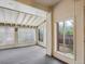 Sun room with many windows and light colored interior providing natural sunlight and outdoor views at 423 Empire St, Aurora, CO 80010