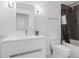 Bathroom featuring a single vanity and shower with dark brown subway tile at 2001 Lincoln St # 1822, Denver, CO 80202