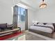 Light filled bedroom boasts city views, neutral decor, and a king bed at 2001 Lincoln St # 1822, Denver, CO 80202