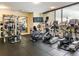 Bright community gym with elliptical machines, treadmills, and weightlifting equipment at 2001 Lincoln St # 1822, Denver, CO 80202