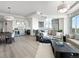 Open concept living space featuring floor to ceiling windows, modern decor and stainless steel appliances at 2001 Lincoln St # 1822, Denver, CO 80202