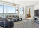 Living room with city views, neutral decor, sleek furnishings, and light wood floors at 2001 Lincoln St # 1822, Denver, CO 80202
