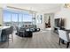 Open concept living space featuring floor to ceiling windows, modern decor and stainless steel appliances at 2001 Lincoln St # 1822, Denver, CO 80202