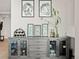 Custom storage with glass doors for displaying barware, decor, and beverages at 2001 Lincoln St # 1822, Denver, CO 80202