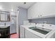 Convenient laundry room with machines and cabinet offers efficiency at 430 Chestnut Way, Broomfield, CO 80020