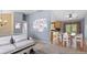 Open floor plan showcasing the living room and kitchen area with ample natural light, stylish furniture, and wood floors at 430 Chestnut Way, Broomfield, CO 80020