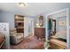 Cozy living room with wood floors and a view into the bedroom at 430 Chestnut Way, Broomfield, CO 80020