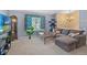 Comfortable living room featuring a large sectional couch, wood coffee table, and ample natural light at 430 Chestnut Way, Broomfield, CO 80020