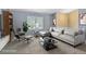 Bright living room with large window, stylish furnishings, and neutral decor, creating a comfortable and inviting space at 430 Chestnut Way, Broomfield, CO 80020
