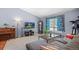 Inviting living room with large sectional, wooden piano, and ample space at 430 Chestnut Way, Broomfield, CO 80020