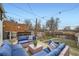 Backyard patio area featuring wicker couches with blue cushions at 3384 W 29Th Ave, Denver, CO 80211