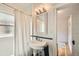 Bright bathroom featuring a stand alone sink and shower with subway tile and blue accents at 3384 W 29Th Ave, Denver, CO 80211