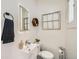 Stylish powder room features modern vanity, sink and decorative shelving at 3384 W 29Th Ave, Denver, CO 80211