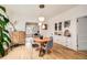 Bright dining room with hardwood floors, built-in cabinets, and decorative pendant lighting at 3384 W 29Th Ave, Denver, CO 80211