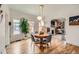 Bright dining room with hardwood floors and decorative pendant lighting at 3384 W 29Th Ave, Denver, CO 80211