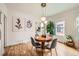 Bright dining room with hardwood floors and decorative pendant lighting at 3384 W 29Th Ave, Denver, CO 80211