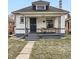 Charming bungalow featuring a cozy front porch, well-maintained lawn, and inviting curb appeal at 3384 W 29Th Ave, Denver, CO 80211