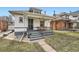 Charming bungalow featuring a cozy front porch, well-maintained lawn, and inviting curb appeal at 3384 W 29Th Ave, Denver, CO 80211