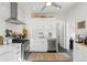 Stylish kitchen featuring white cabinetry, subway tile backsplash, and stainless steel appliances at 3384 W 29Th Ave, Denver, CO 80211