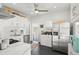 Bright kitchen featuring white cabinets, stainless steel appliances, and modern finishes at 3384 W 29Th Ave, Denver, CO 80211
