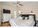 Spacious bedroom featuring hardwood floors, ceiling fan, and dresser at 3384 W 29Th Ave, Denver, CO 80211