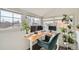 Bright home office space featuring a stand-up desk with large monitors and several plants at 3384 W 29Th Ave, Denver, CO 80211