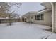 House exterior and snowy backyard view at 646 N 13Th Ave, Brighton, CO 80601