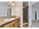 Bathroom with shower, vanity, and neutral tile flooring at 646 N 13Th Ave, Brighton, CO 80601