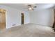 Large bedroom with ceiling fan, neutral walls, and carpet flooring at 646 N 13Th Ave, Brighton, CO 80601