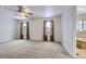 Bright bedroom with carpet, ceiling fan, and two windows at 646 N 13Th Ave, Brighton, CO 80601