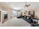 Open living room, featuring a fireplace and access to kitchen and dining area at 646 N 13Th Ave, Brighton, CO 80601