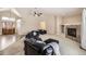 Living room with vaulted ceiling, fireplace and access to foyer at 646 N 13Th Ave, Brighton, CO 80601