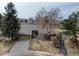 Aerial view showcasing a home with a two-car garage, surrounded by lush greenery and a serene neighborhood setting at 7690 S Uinta Ct, Centennial, CO 80112