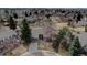 Charming single-story home with mature trees and a well-manicured lawn in a quiet neighborhood at 7690 S Uinta Ct, Centennial, CO 80112