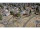 A home backs to a greenbelt, offering a serene setting with mature trees and a walking path at 7690 S Uinta Ct, Centennial, CO 80112