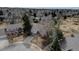 Charming single-story home with mature trees and a well-manicured lawn in a quiet neighborhood at 7690 S Uinta Ct, Centennial, CO 80112