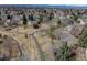 A home backs to a greenbelt, offering a serene setting with mature trees and a walking path at 7690 S Uinta Ct, Centennial, CO 80112