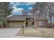 Charming single-Gathering home featuring a two-car garage and lush landscaping, perfect for suburban living at 7690 S Uinta Ct, Centennial, CO 80112