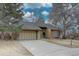 Charming single-Gathering home featuring a two-car garage and lush landscaping, perfect for suburban living at 7690 S Uinta Ct, Centennial, CO 80112